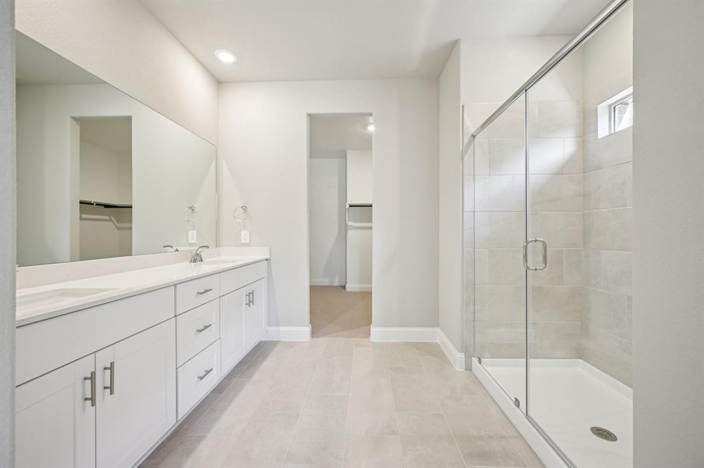 505 Stagg Street McKinney, TX 75069 - Photo 22 of 39 a spacious bathroom with double sink and shower
