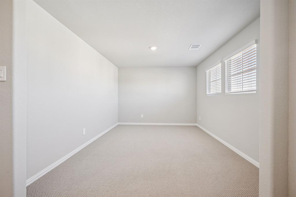 505 Stagg Street McKinney, TX 75069 - Photo 28 of 39 an empty room with a empty space and windows