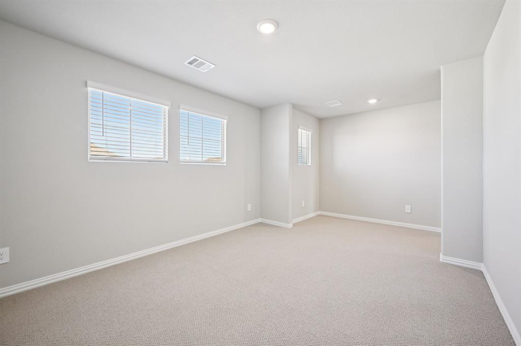 505 Stagg Street McKinney, TX 75069 - Photo 29 of 39 an empty room with a empty space and windows