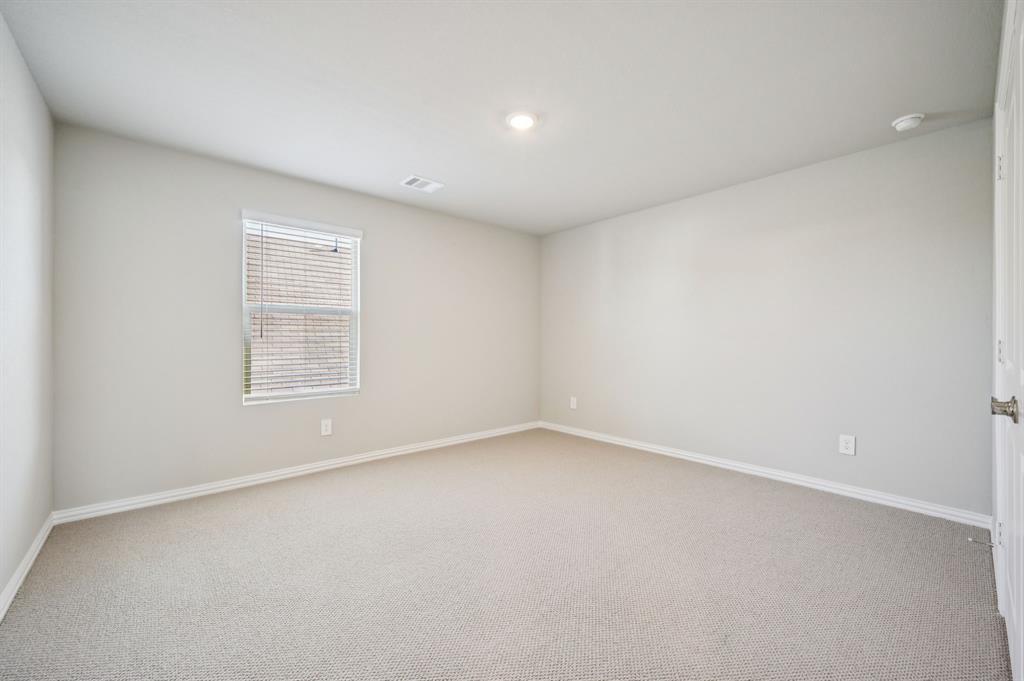 505 Stagg Street McKinney, TX 75069 - Photo 32 of 39 an empty room with a empty space and window