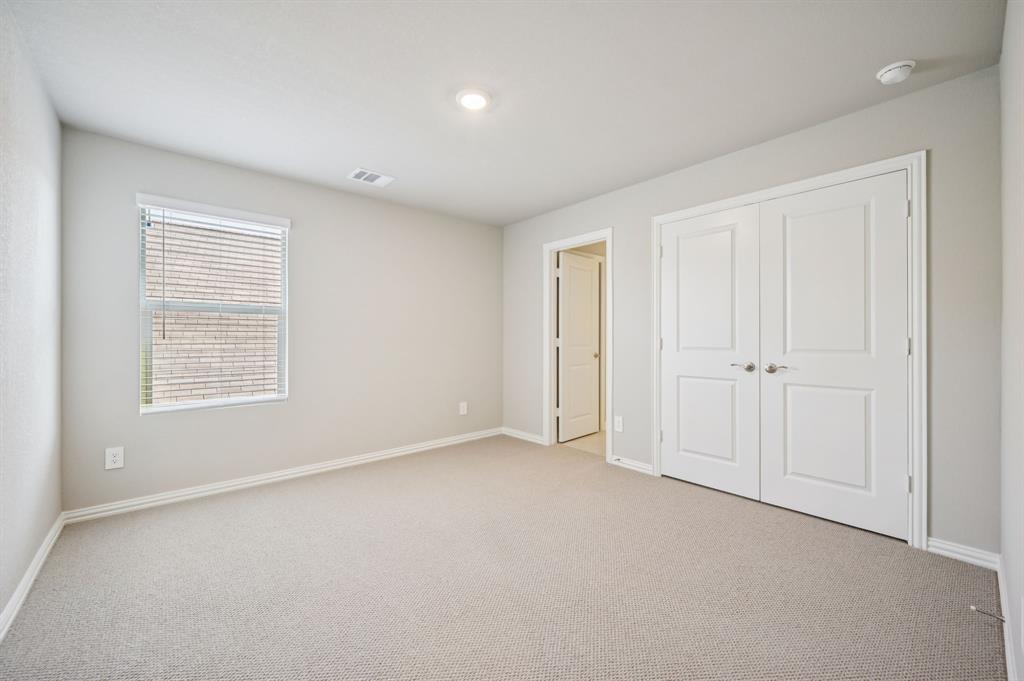 505 Stagg Street McKinney, TX 75069 - Photo 33 of 39 an empty room with windows