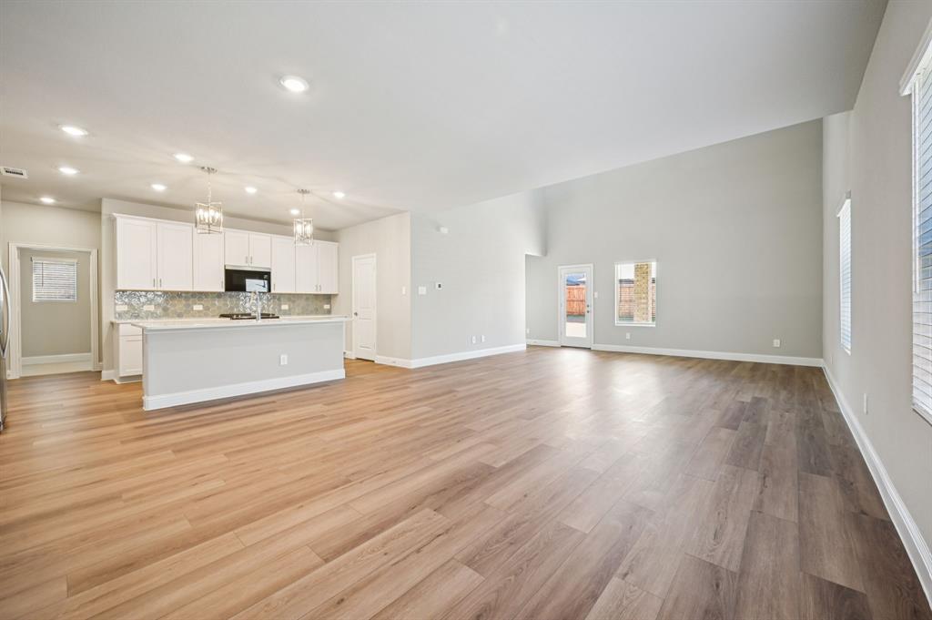 505 Stagg Street McKinney, TX 75069 - Photo 7 of 39 a view of kitchen with wooden floor and window