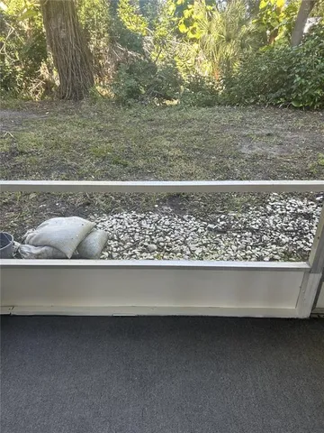 a view of a wooden floor and a yard