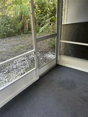 a living room with a black white checkered floor