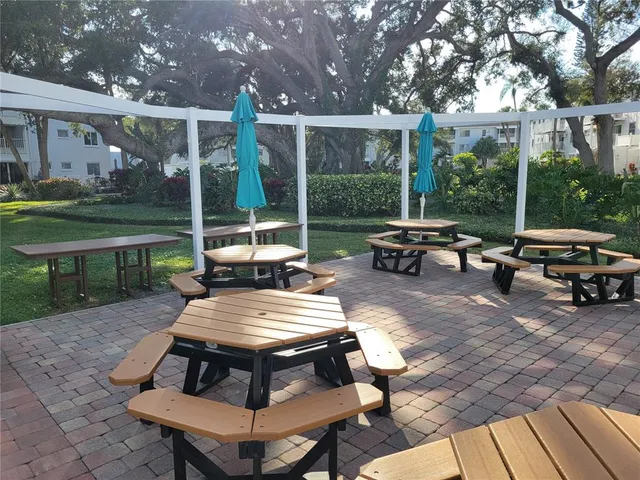 a view of grassy field with benches