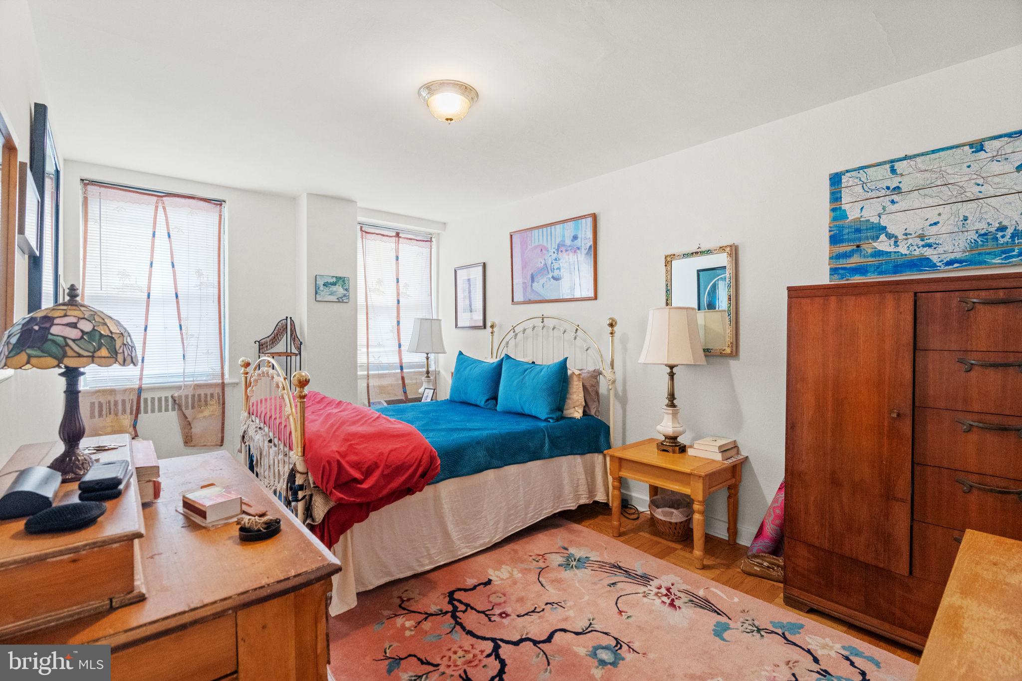 2601 Pennsylvania Avenue, Unit 1132 Philadelphia, PA 19130 - Photo 13 of 28 a living room with furniture a rug and a window