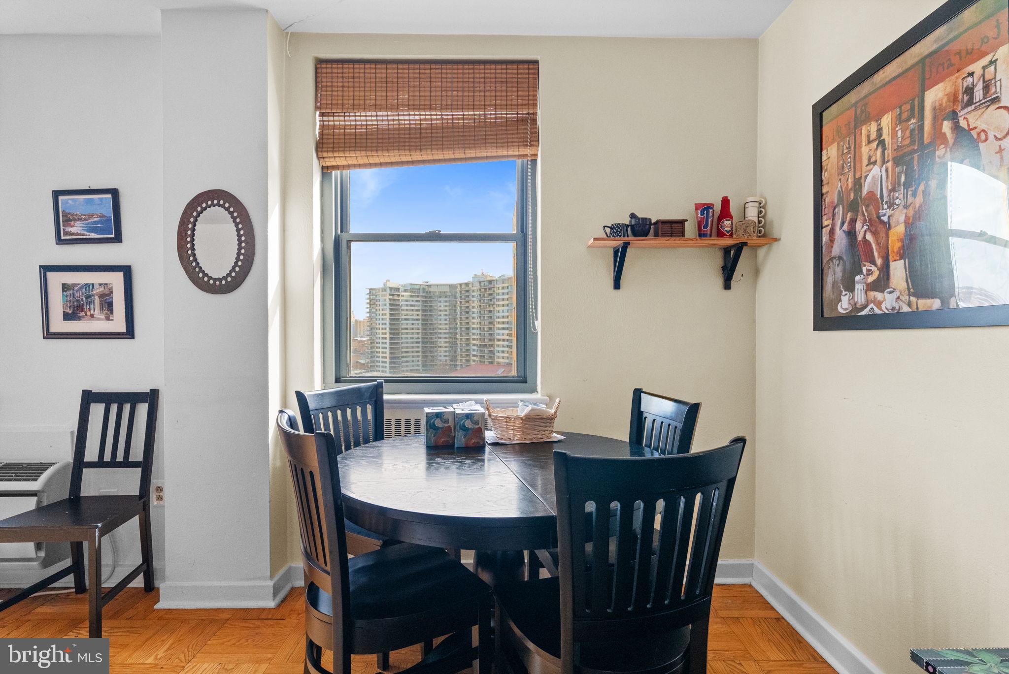 2601 Pennsylvania Avenue, Unit 1132 Philadelphia, PA 19130 - Photo 19 of 28 a view of a dining room with furniture and window