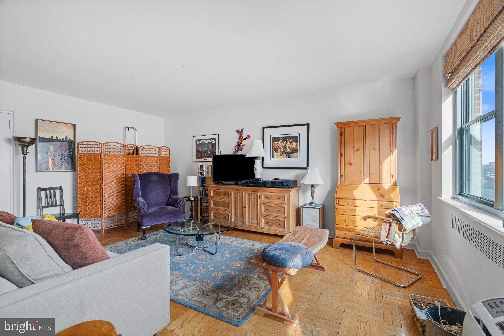 2601 Pennsylvania Avenue, Unit 1132 Philadelphia, PA 19130 - Photo 2 of 28 a living room with furniture windows and a flat screen tv