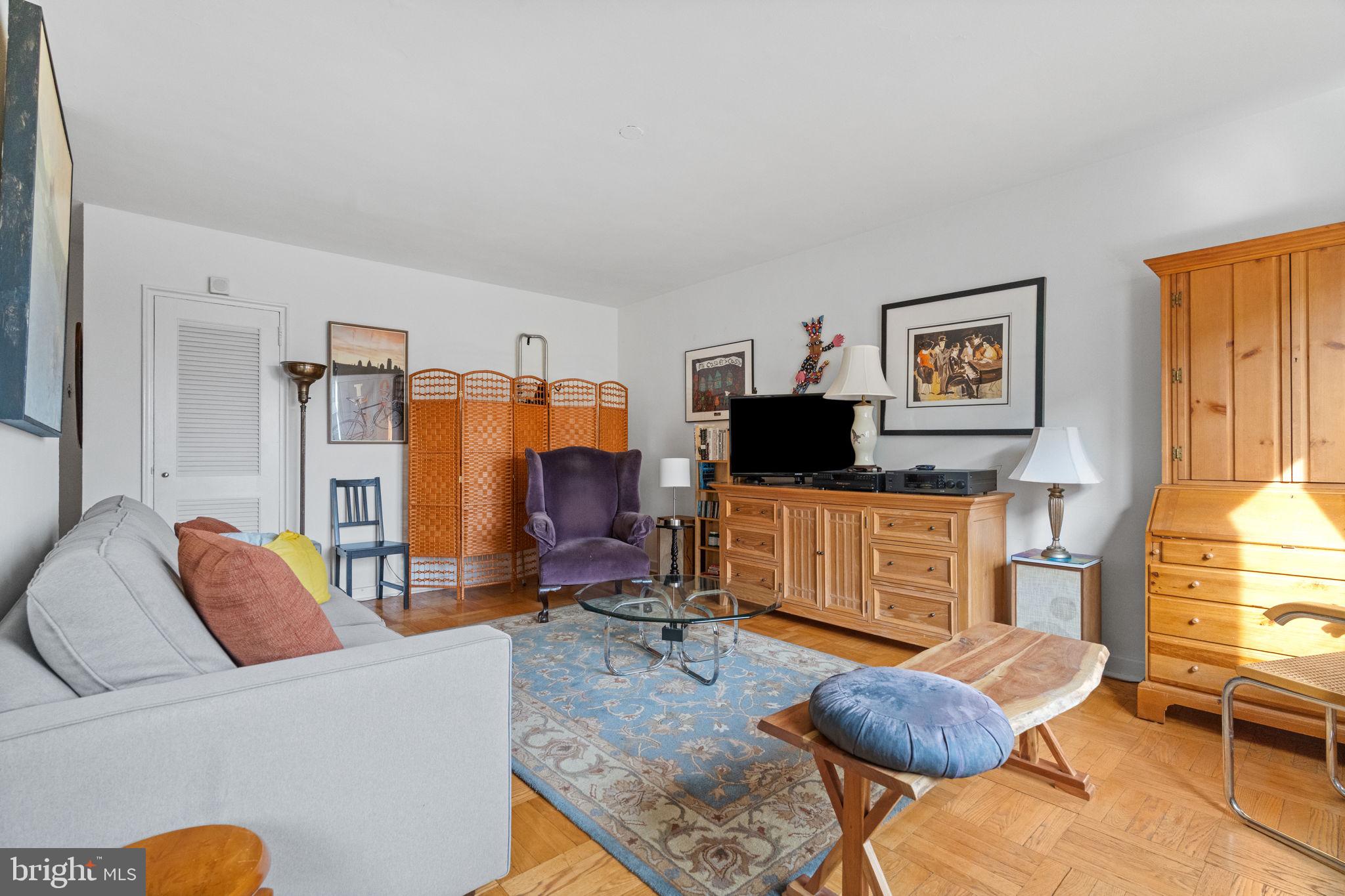 2601 Pennsylvania Avenue, Unit 1132 Philadelphia, PA 19130 - Photo 26 of 28 a living room with furniture and a flat screen tv