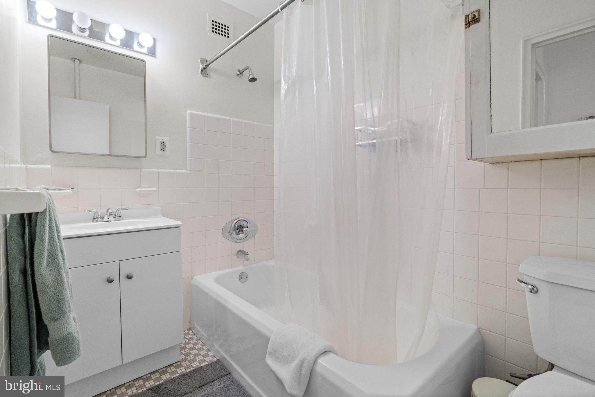 2601 Pennsylvania Avenue, Unit 1132 Philadelphia, PA 19130 - Photo 28 of 28 a bathroom with a sink toilet and shower