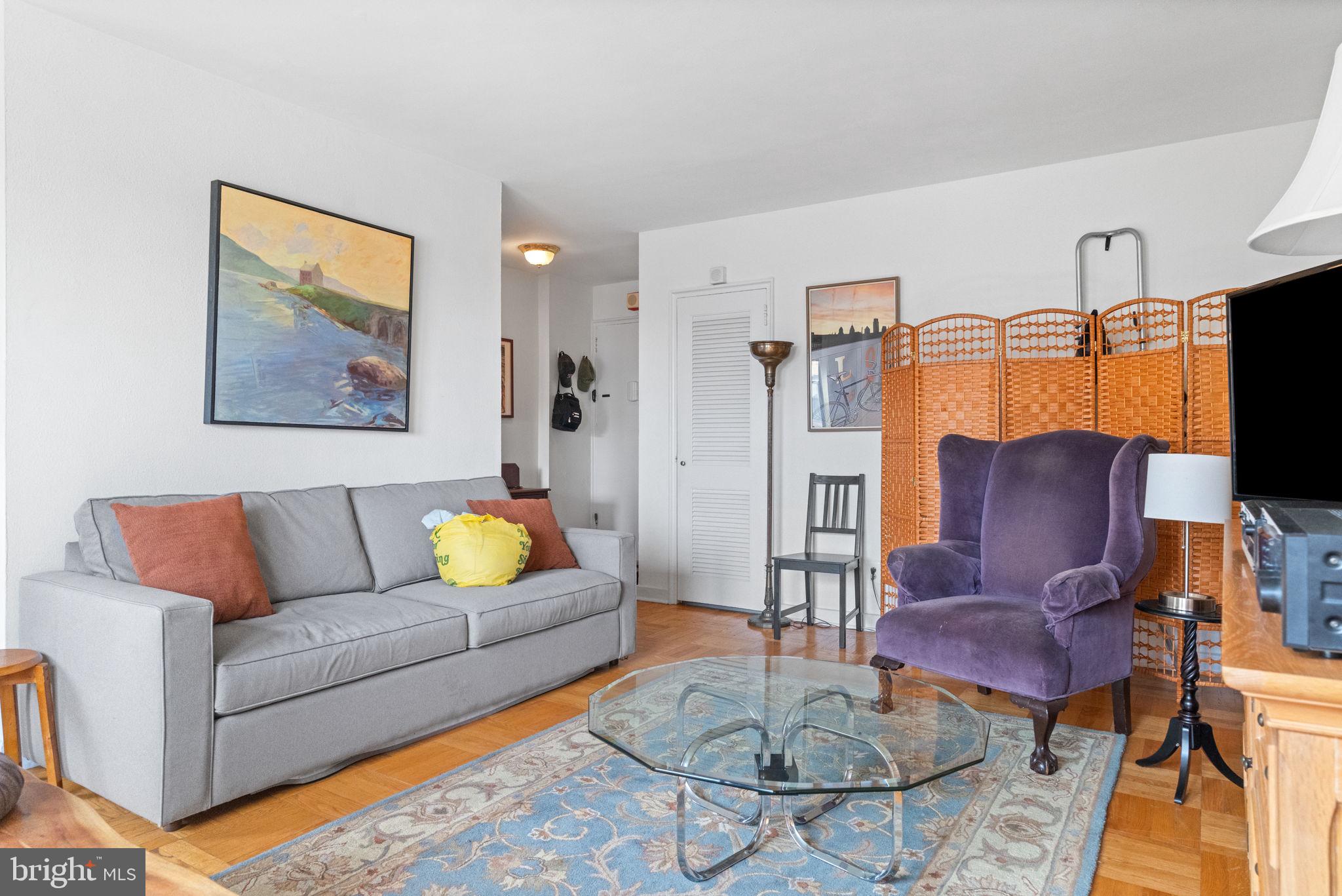 2601 Pennsylvania Avenue, Unit 1132 Philadelphia, PA 19130 - Photo 4 of 28 a living room with furniture and a flat screen tv