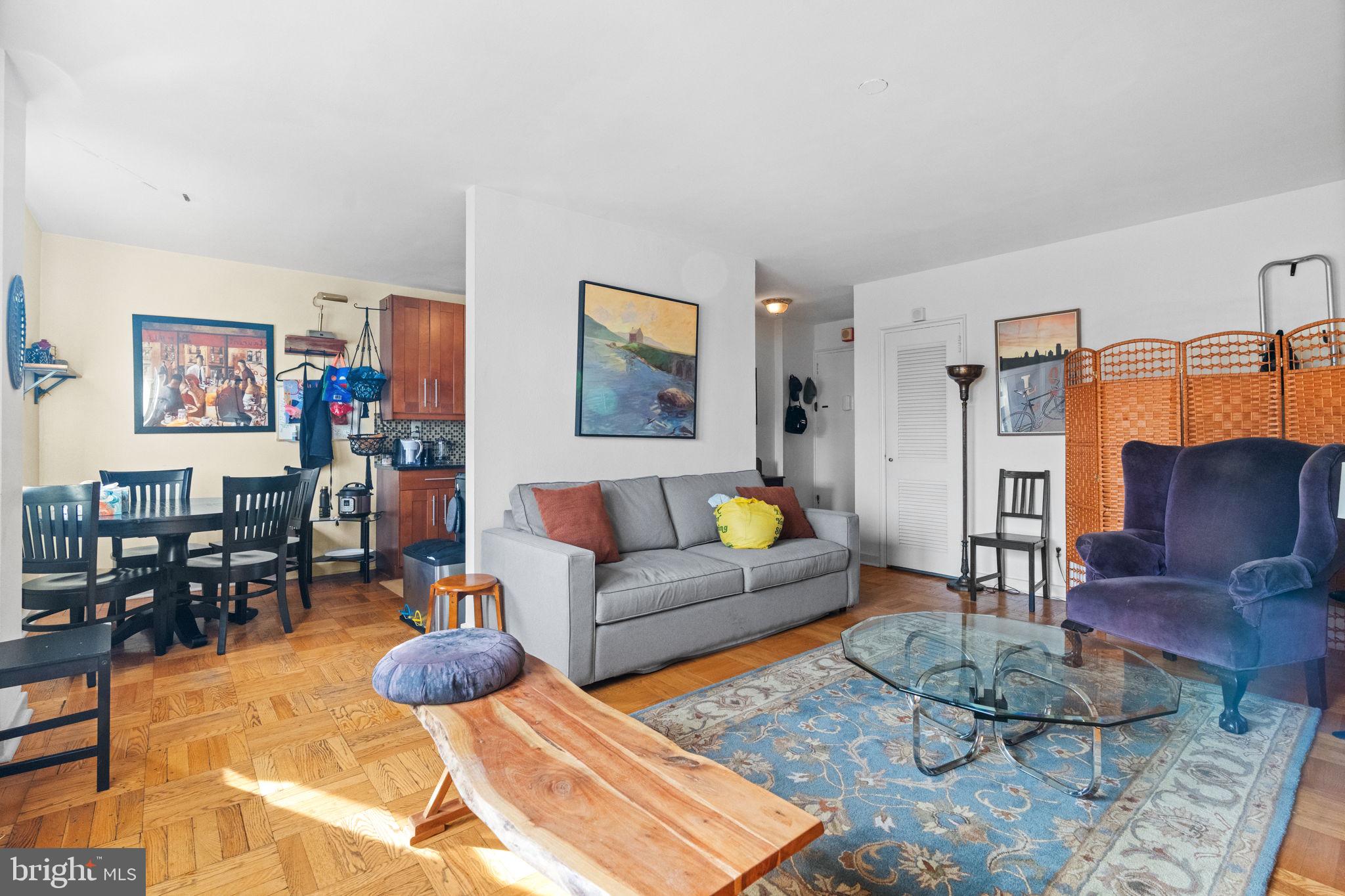 2601 Pennsylvania Avenue, Unit 1132 Philadelphia, PA 19130 - Photo 5 of 28 a living room with furniture and wooden floor