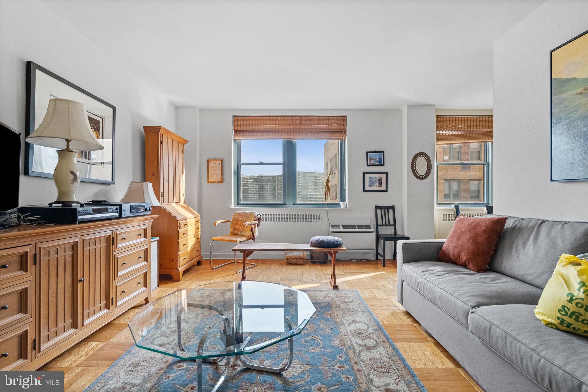 2601 Pennsylvania Avenue, Unit 1132 Philadelphia, PA 19130 - Photo 7 of 28 a living room with furniture and a window
