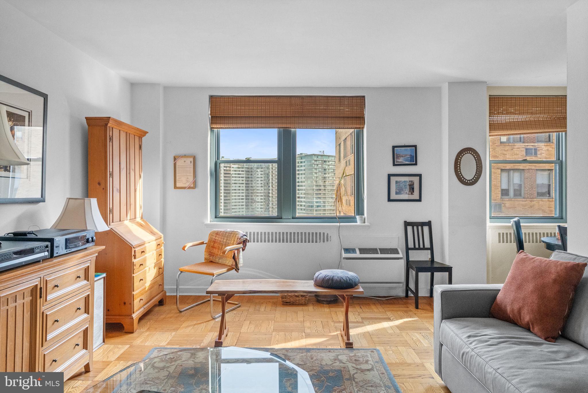 2601 Pennsylvania Avenue, Unit 1132 Philadelphia, PA 19130 - Photo 9 of 28 a living room with furniture and a window