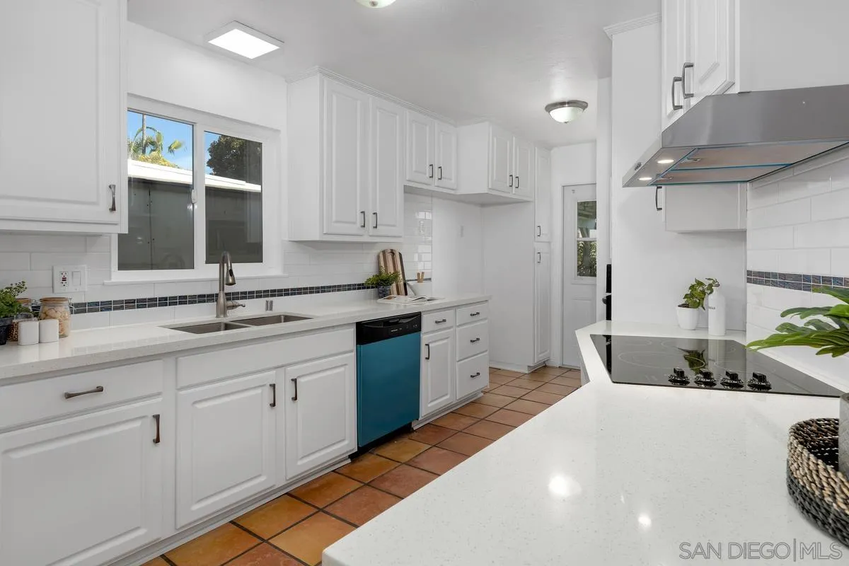 2567 Pheasant Drive San Diego, CA 92123 - Photo 11 of 31 a kitchen with a sink and cabinets