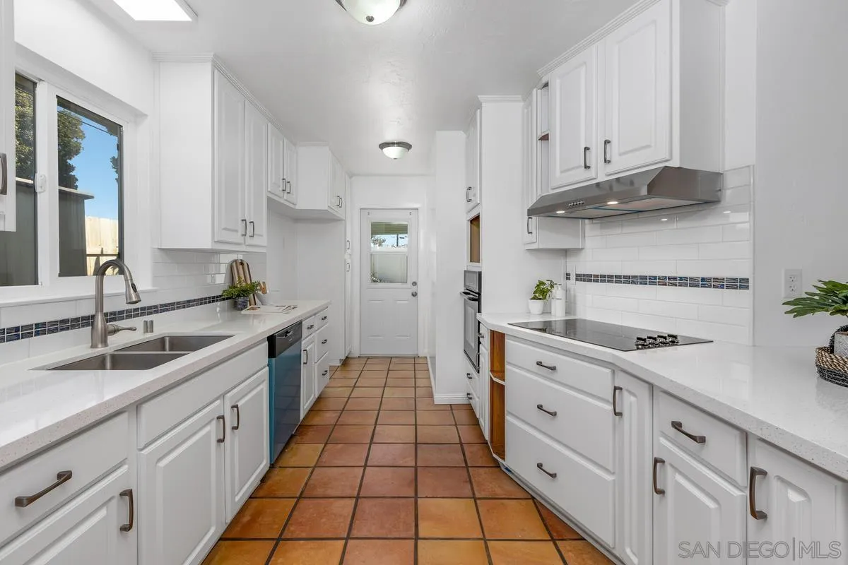 2567 Pheasant Drive San Diego, CA 92123 - Photo 12 of 31 a large kitchen with cabinets