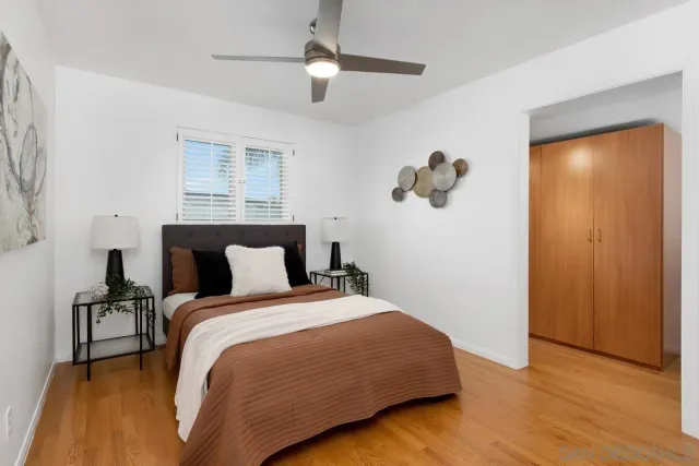 a bedroom with bed and window