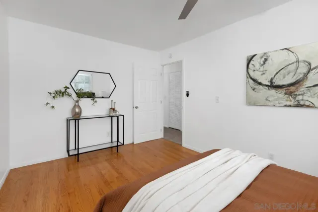 a bedroom with a bed and chandelier