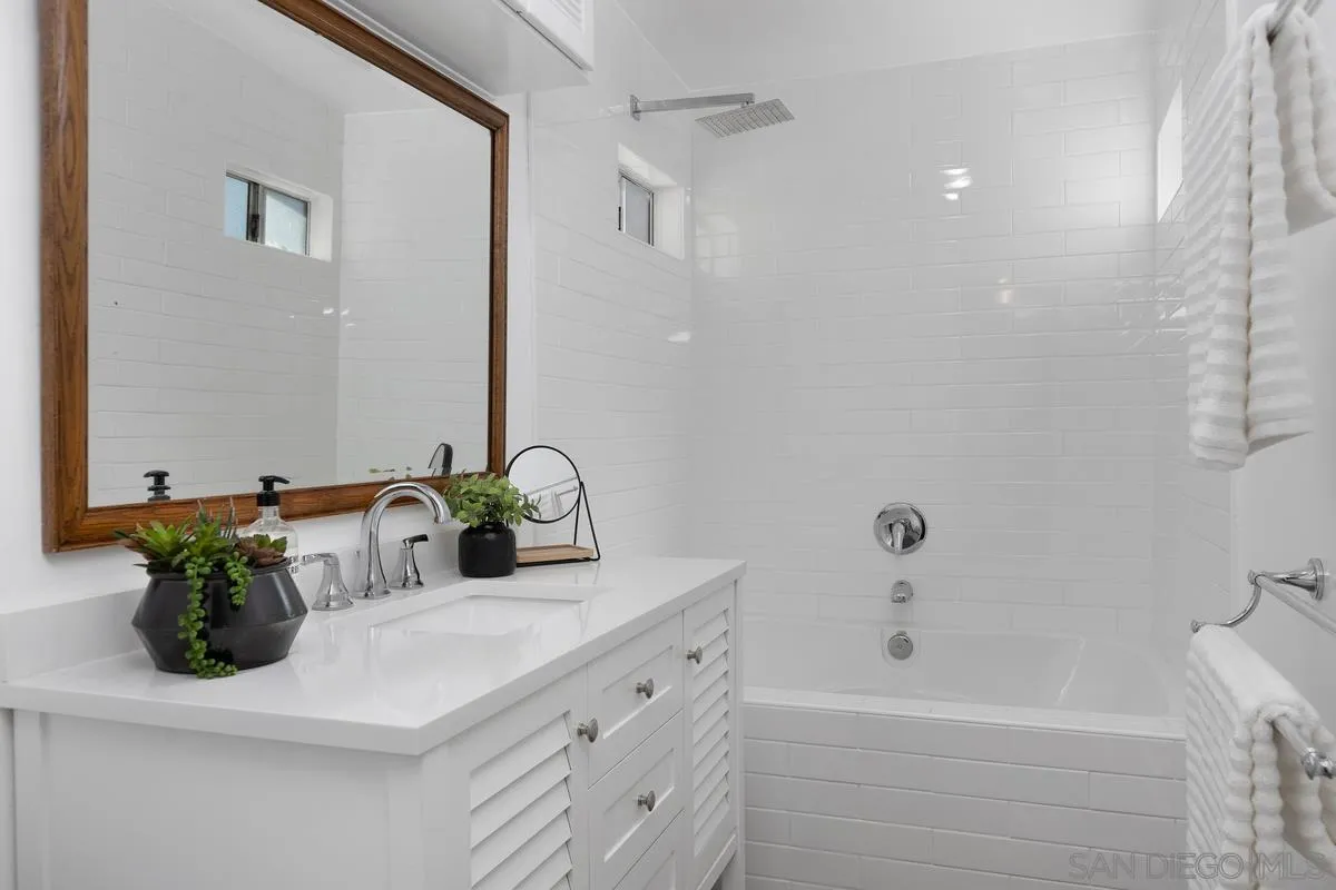2567 Pheasant Drive San Diego, CA 92123 - Photo 19 of 31 a bathroom with a sink and a bathtub