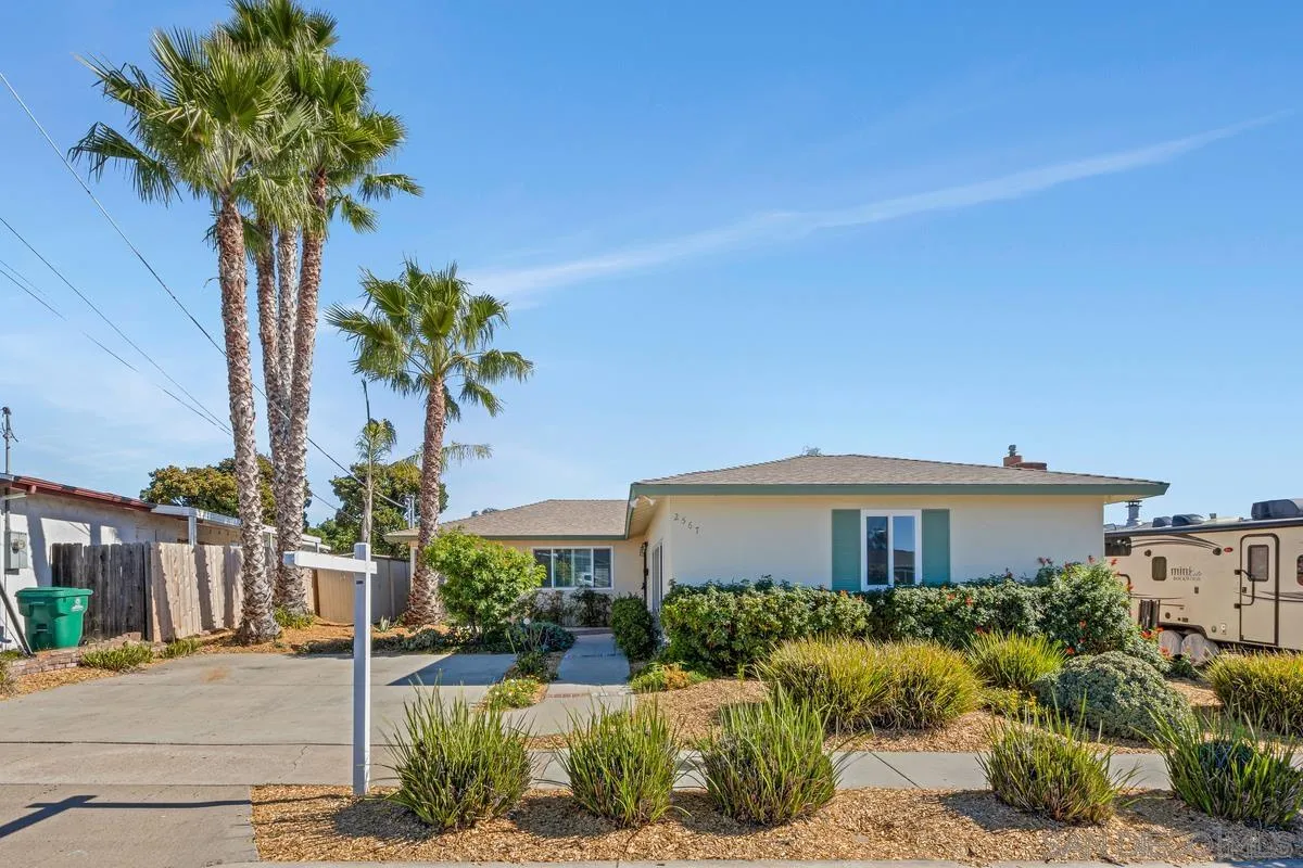 2567 Pheasant Drive San Diego, CA 92123 - Photo 2 of 31 a front view of a house with a yard and potted plants