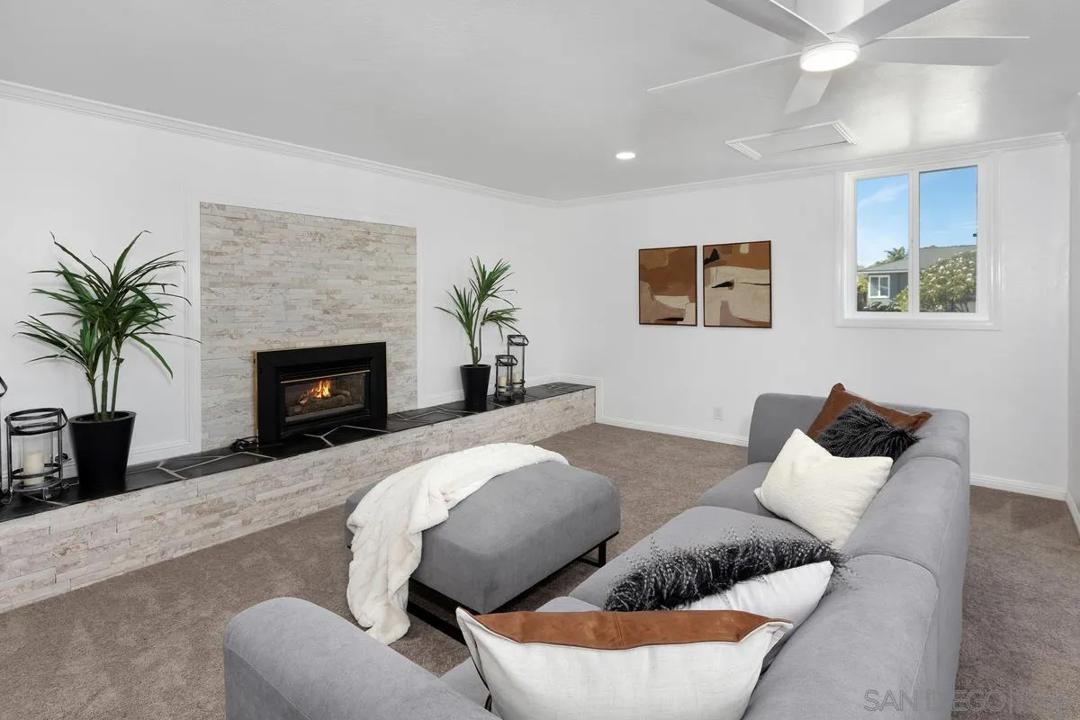 2567 Pheasant Drive San Diego, CA 92123 - Photo 23 of 31 a living room with furniture and a fireplace