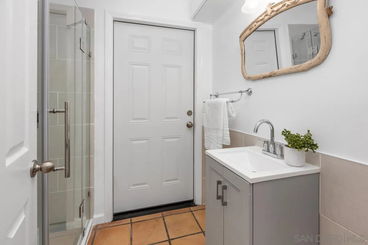 2567 Pheasant Drive San Diego, CA 92123 - Photo 25 of 31 a bathroom with a sink and a mirror