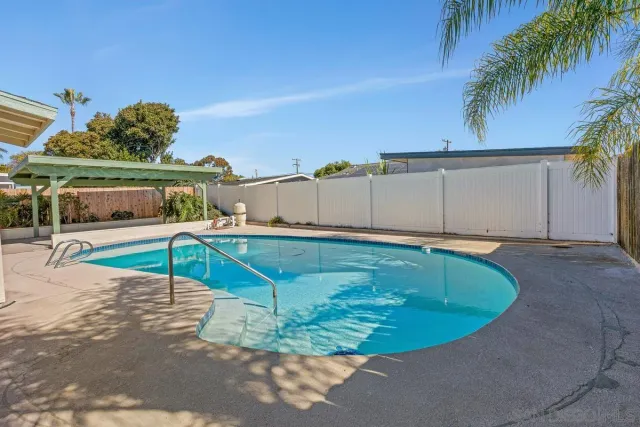 a house view with a backyard space