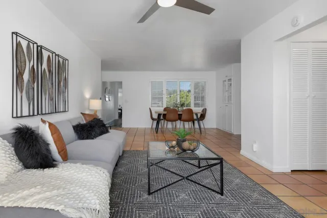 a living room with furniture rug and window