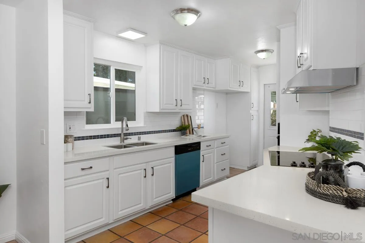 2567 Pheasant Drive San Diego, CA 92123 - Photo 10 of 31 a kitchen with a sink dishwasher and white cabinets