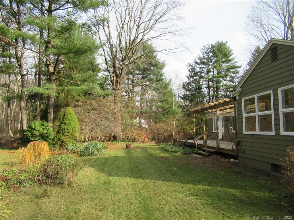 11 Burnt Swamp Road Woodbridge, CT 06525 - Photo 25 of 29 a view of a house with backyard