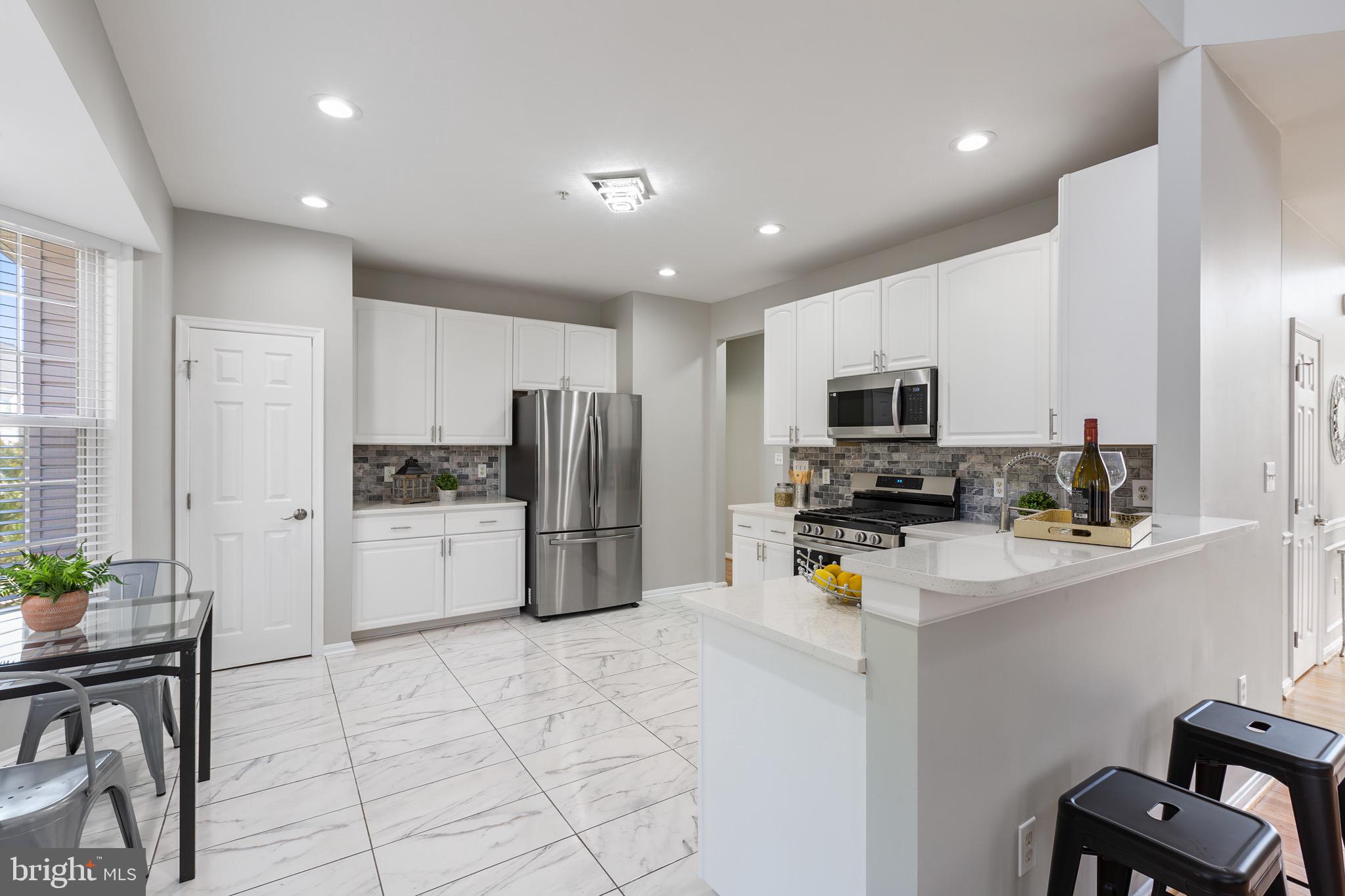 11400 Belvidere Road Bowie, MD 20721 - Photo 14 of 49 Renovated kitchen with gorgeous quartz counters