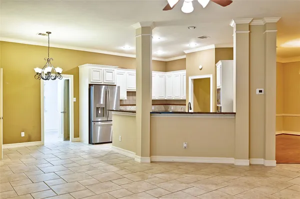 a kitchen with a refrigerator and a sink