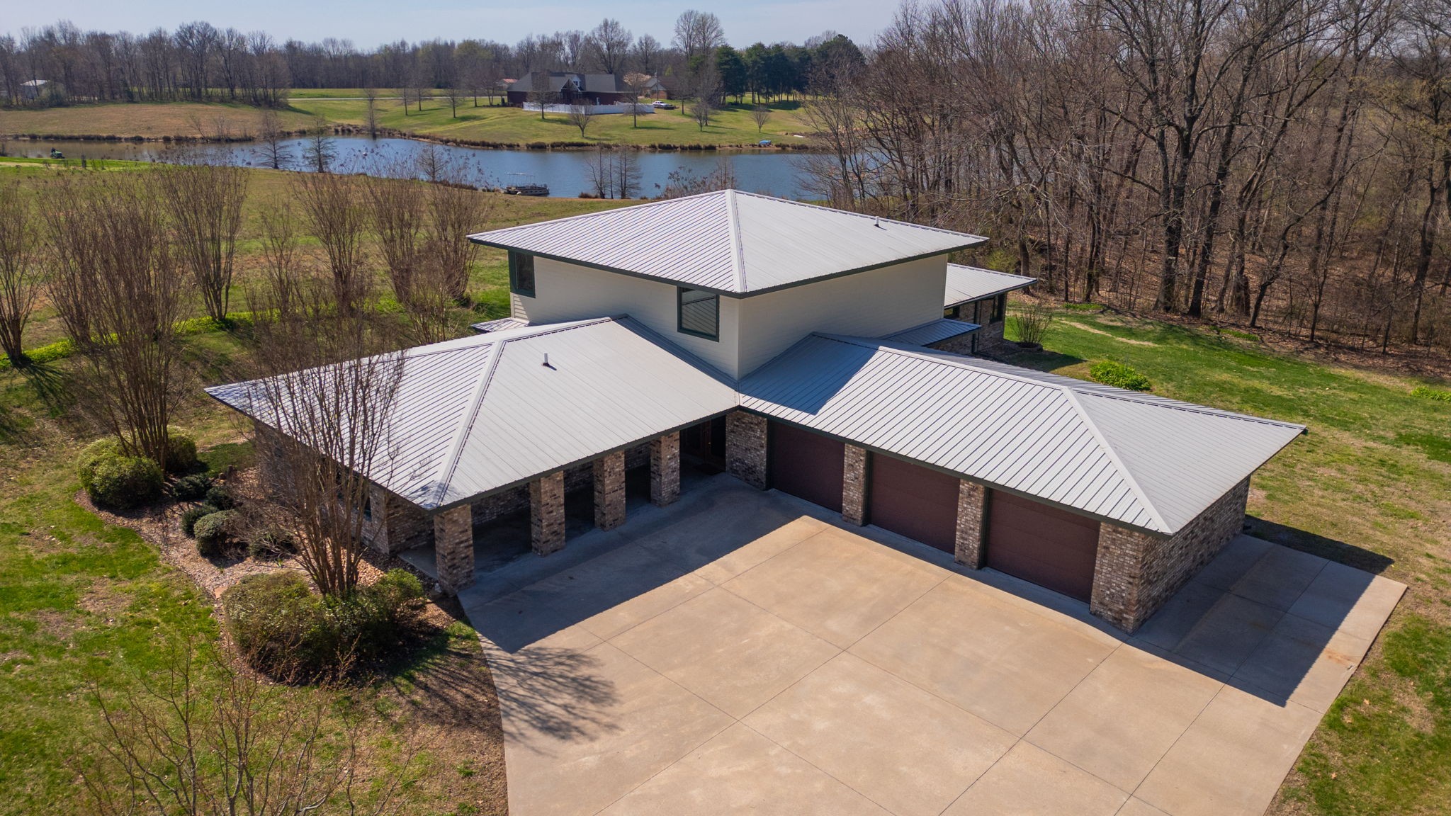 205 Lewis Lane Clinton, KY 42031 - Photo 1 of 86 an aerial view of a house with swimming pool and a yard