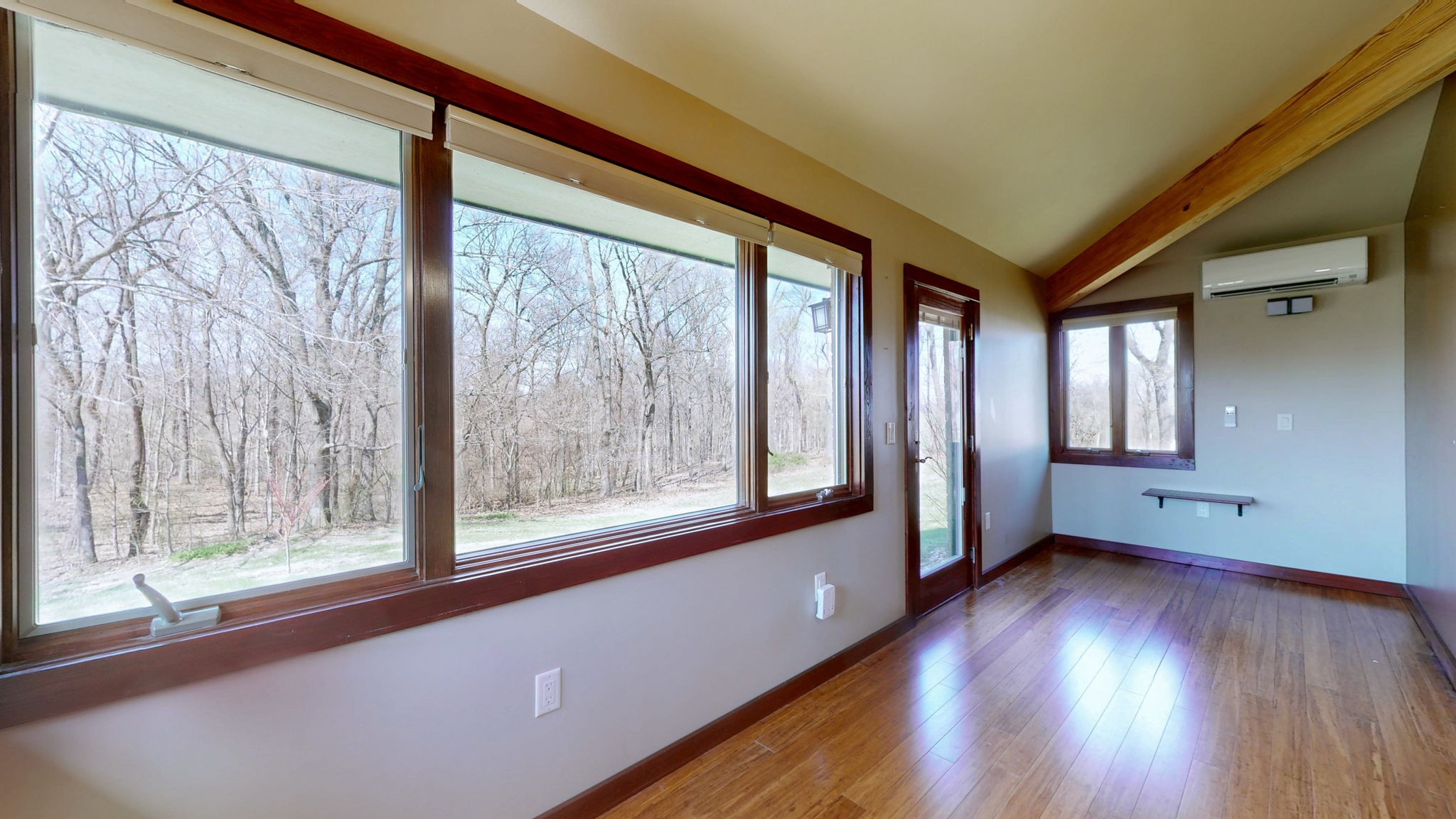 205 Lewis Lane Clinton, KY 42031 - Photo 14 of 86 a view of an empty room with wooden floor and a window