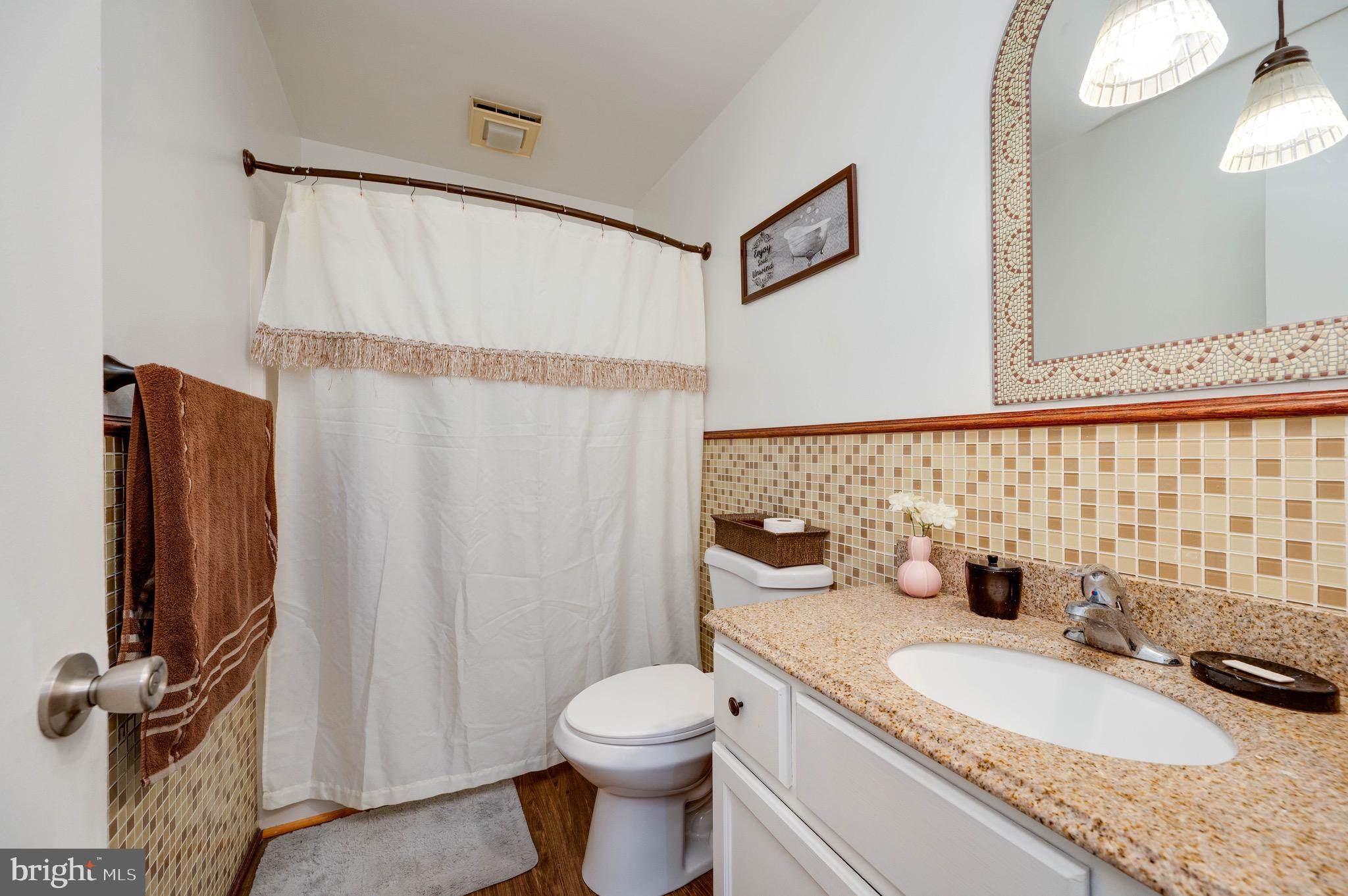 11 Nottingham Court Reading, PA 19601 - Photo 17 of 29 a bathroom with a granite countertop sink toilet and shower