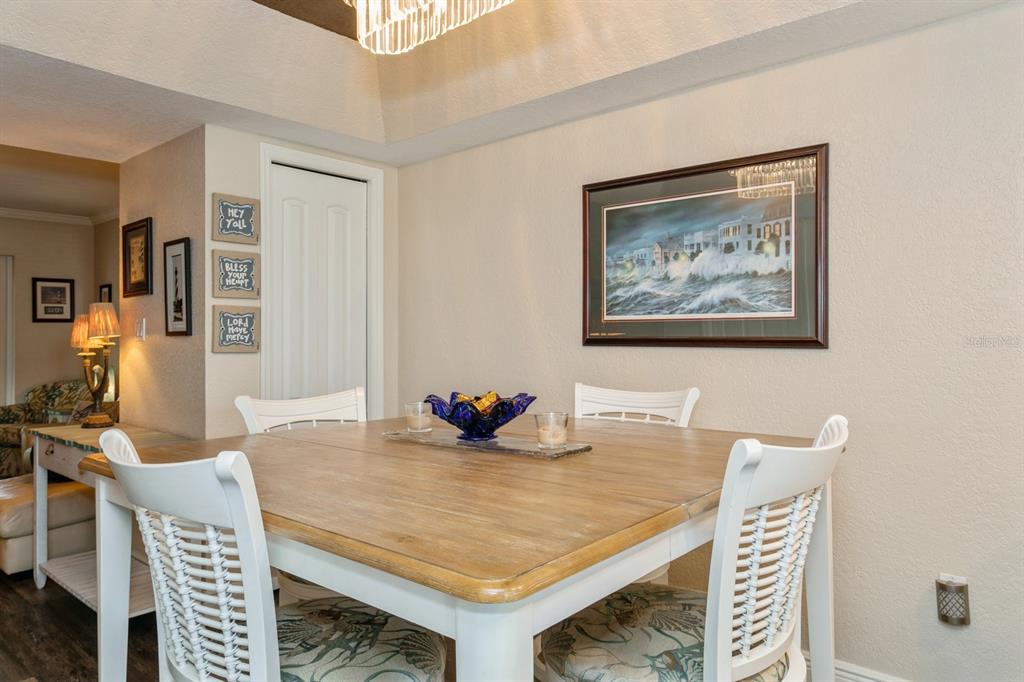 9166 Blind Pass Road St. Pete Beach, FL 33706 - Photo 14 of 37 a view of a dining room with furniture