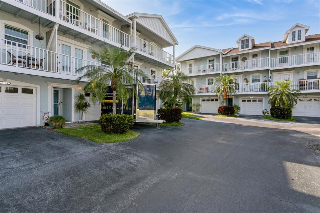9166 Blind Pass Road St. Pete Beach, FL 33706 - Photo 36 of 37 a view of a street with a building in the background