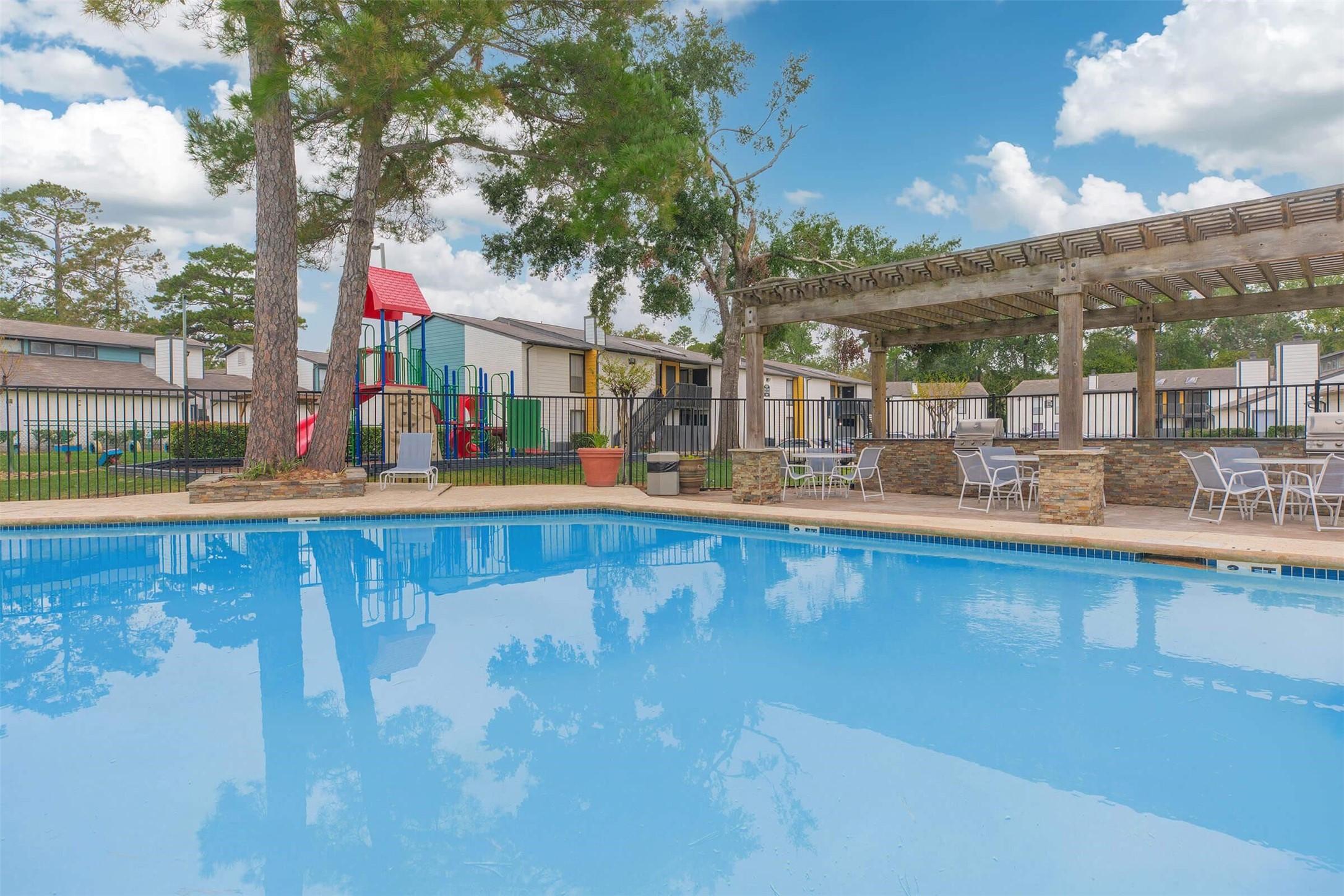 21717 Inverness Forest Boulevard, Unit 1911 Houston, TX 77073 - Photo 26 of 29 a view of swimming pool with outdoor seating and city view