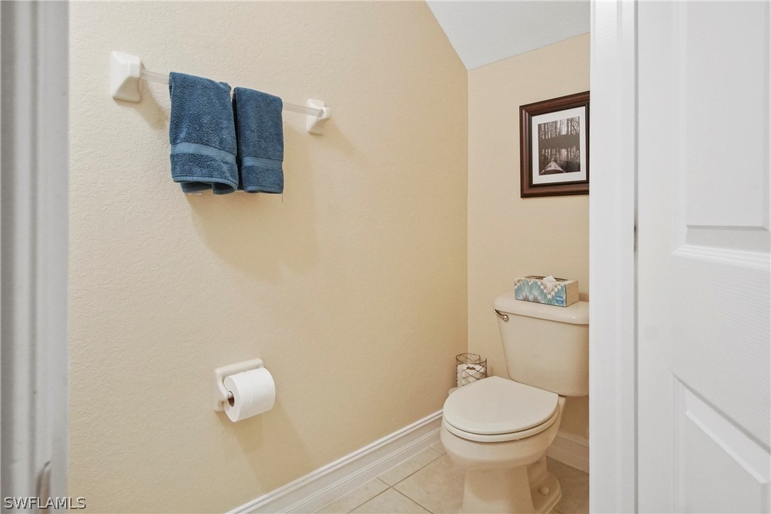 9070 Water Tupelo Road Fort Myers, FL 33912 - Photo 15 of 29 a white toilet sitting next to a bathroom sink