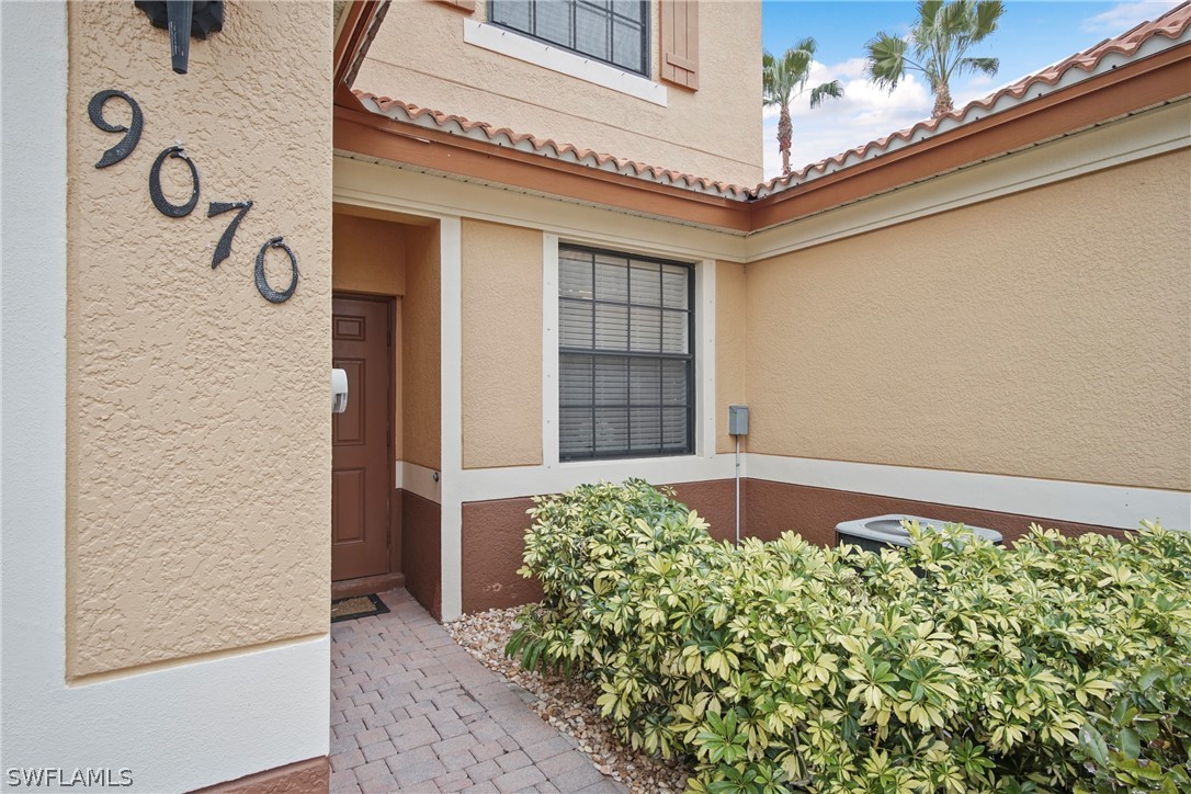 9070 Water Tupelo Road Fort Myers, FL 33912 - Photo 2 of 29 a front view of a house