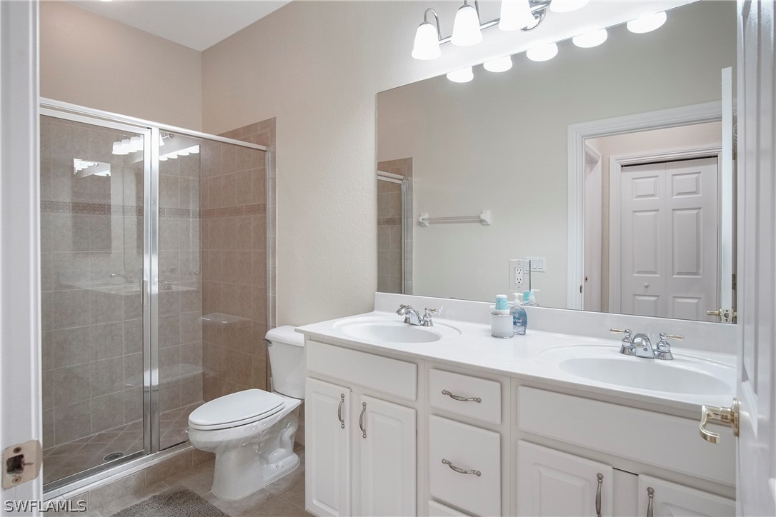 9070 Water Tupelo Road Fort Myers, FL 33912 - Photo 25 of 29 a bathroom with a sink a toilet and shower