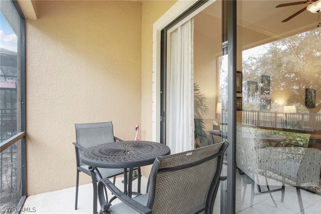 9070 Water Tupelo Road Fort Myers, FL 33912 - Photo 27 of 29 a view of a table and chairs in the balcony