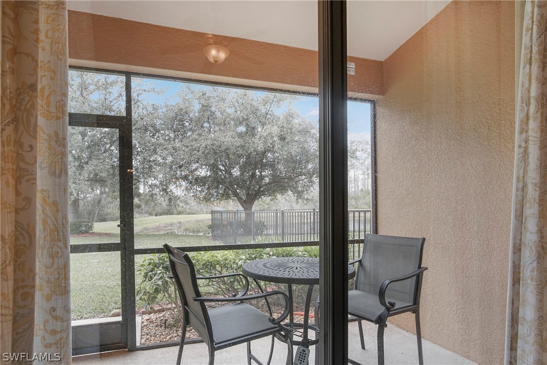 9070 Water Tupelo Road Fort Myers, FL 33912 - Photo 28 of 29 a view of a room with a furniture and balcony