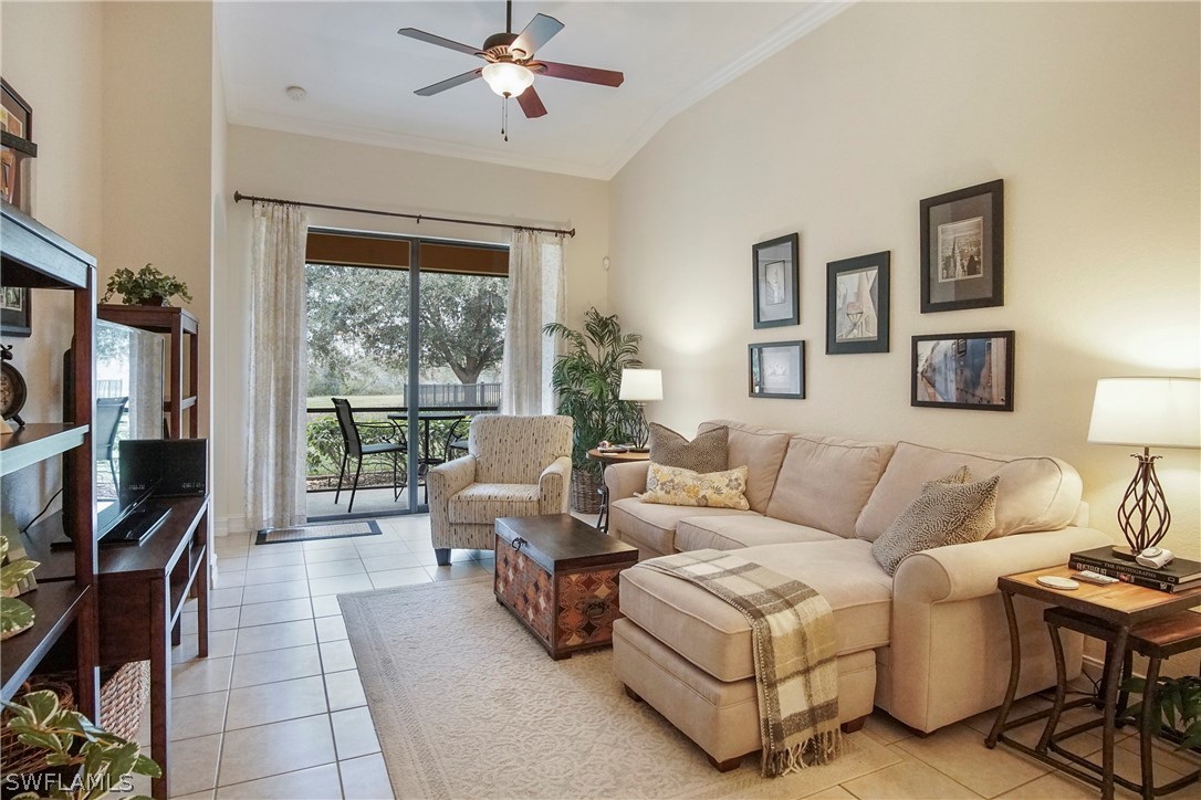 9070 Water Tupelo Road Fort Myers, FL 33912 - Photo 5 of 29 a living room with furniture and a flat screen tv