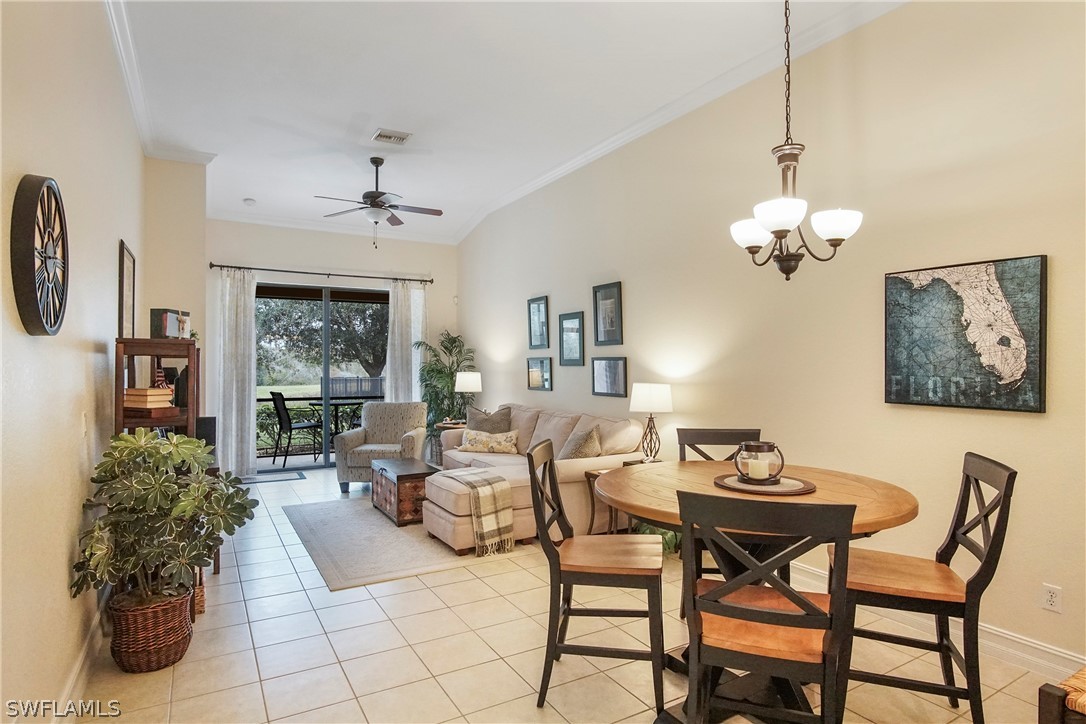 9070 Water Tupelo Road Fort Myers, FL 33912 - Photo 6 of 29 a living room with furniture a chandelier and a chandelier
