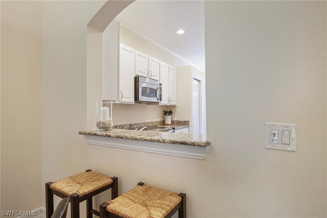 9070 Water Tupelo Road Fort Myers, FL 33912 - Photo 9 of 29 a view of a kitchen with cabinets