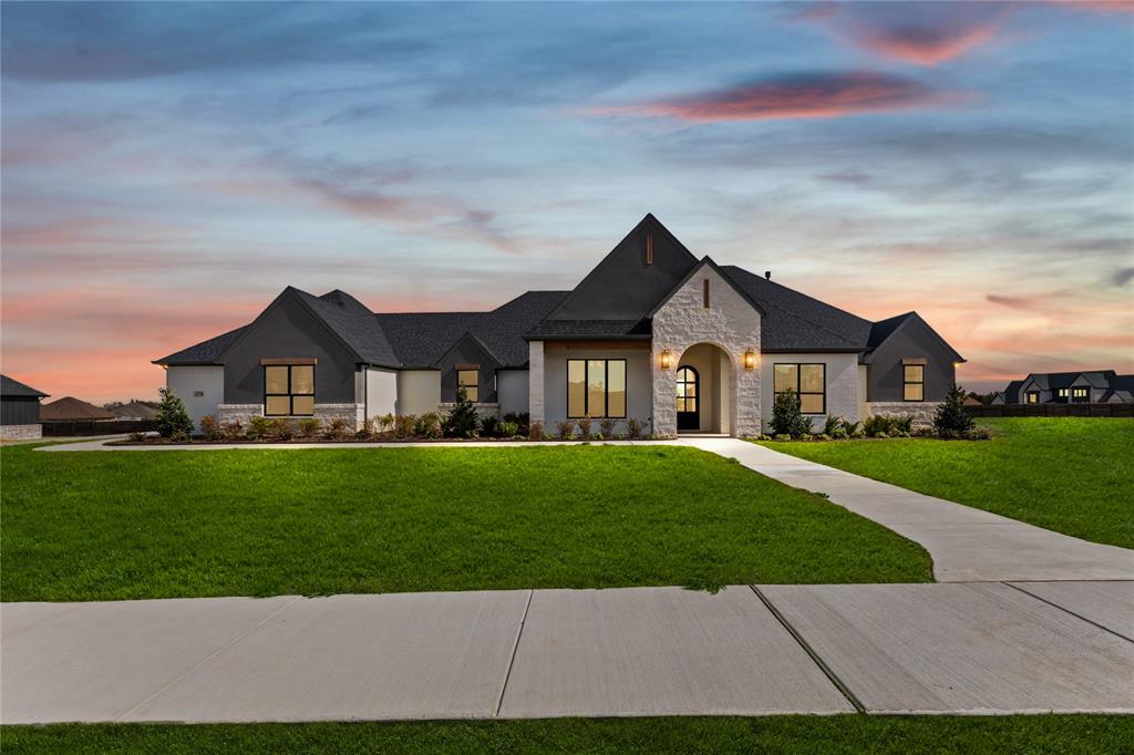 4720 Magnolia Trail Midlothian, TX 76065 - Photo 1 of 40 a front view of a house with a yard