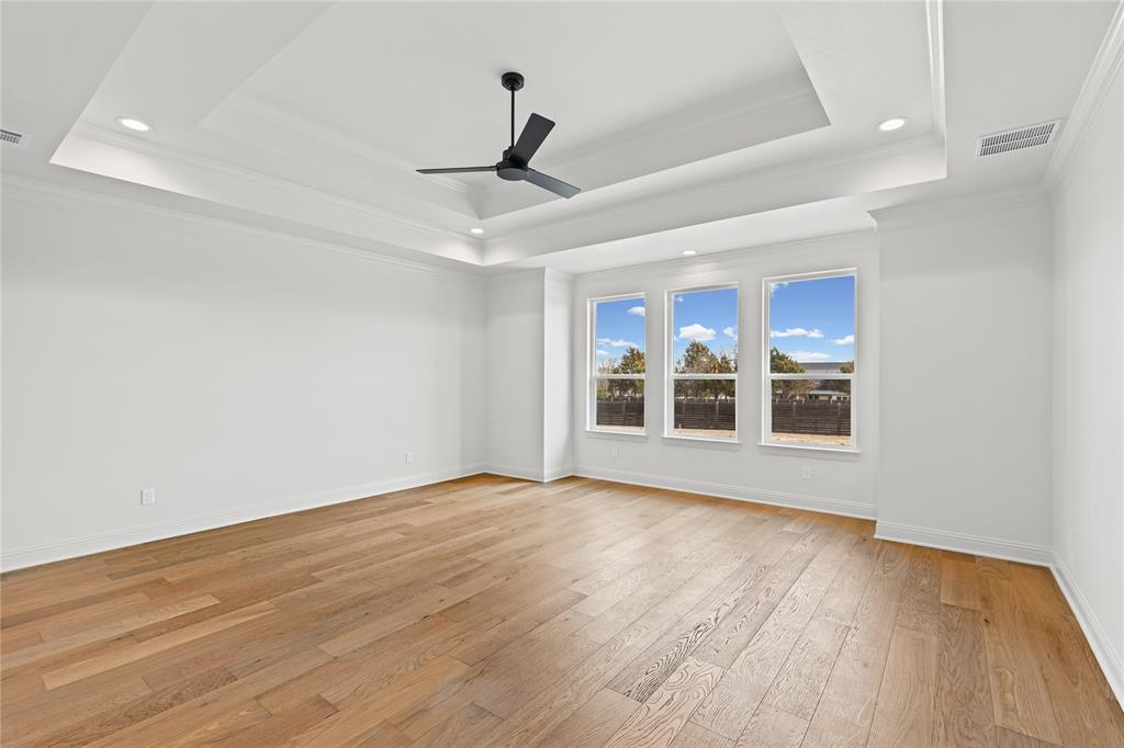 4720 Magnolia Trail Midlothian, TX 76065 - Photo 19 of 40 a view of an empty room with wooden floor and a window