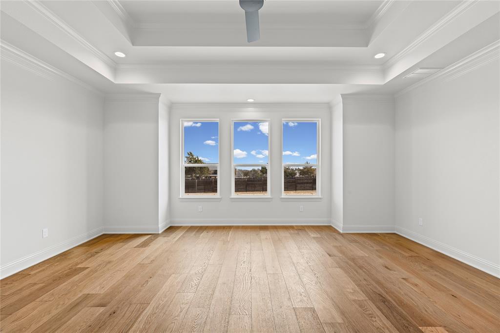 4720 Magnolia Trail Midlothian, TX 76065 - Photo 20 of 40 a view of an empty room with wooden floor and a window