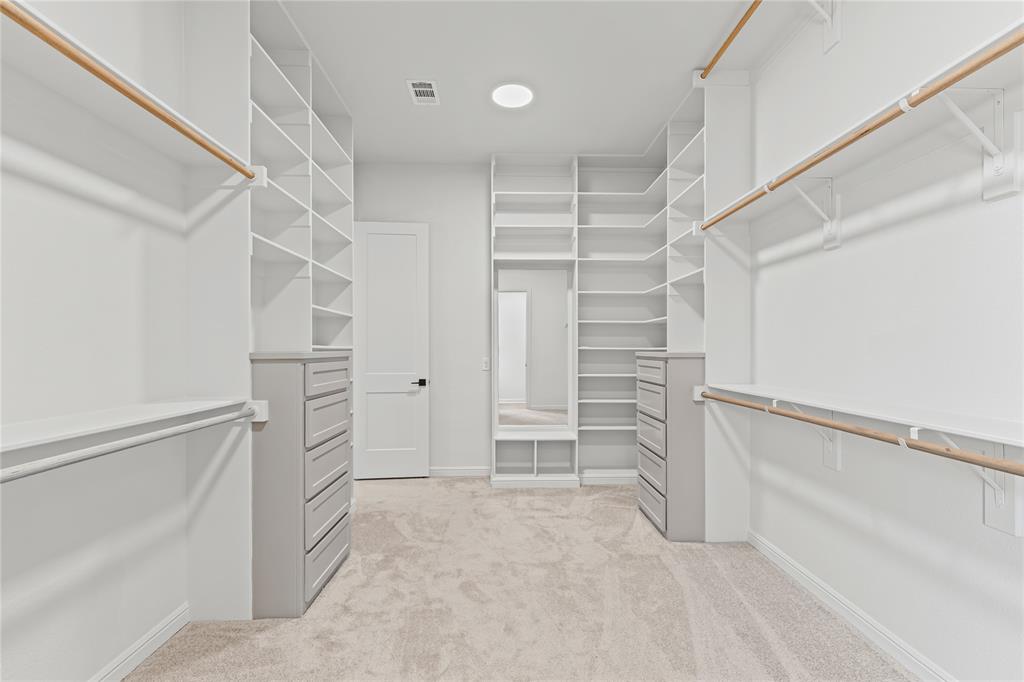 4720 Magnolia Trail Midlothian, TX 76065 - Photo 28 of 40 a view of walk in closet with empty racks